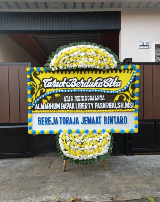 Papan Bunga Duka di Doufo